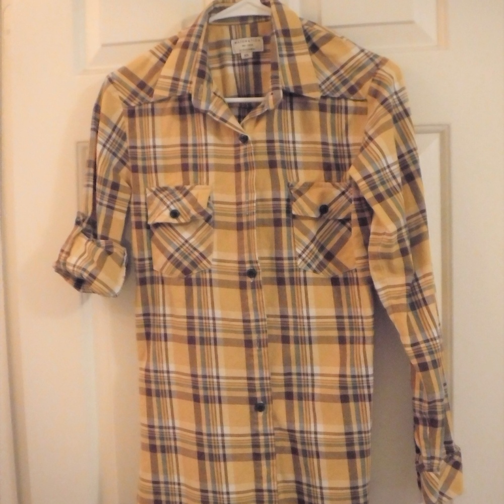 Long sleeved or 3/4 sleeve flannel shirt.